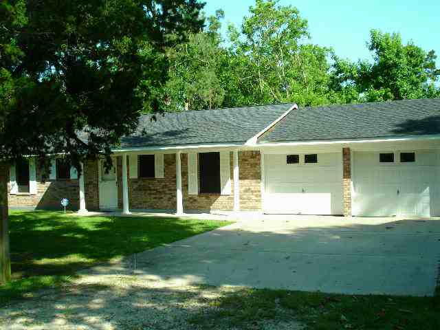 • Click for larger view of this White home, with front vinyl Bay window, white vinyl trim and a grey roof •