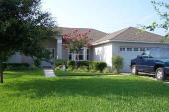 • Click for larger view of this White home, with front vinyl Bay window, white vinyl trim and a grey roof •